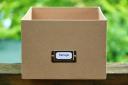 A brown cardbox box labelled with 'storage'