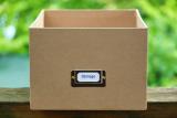 A brown cardbox box labelled with 'storage'
